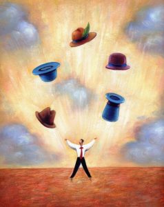 businessman juggling different hats